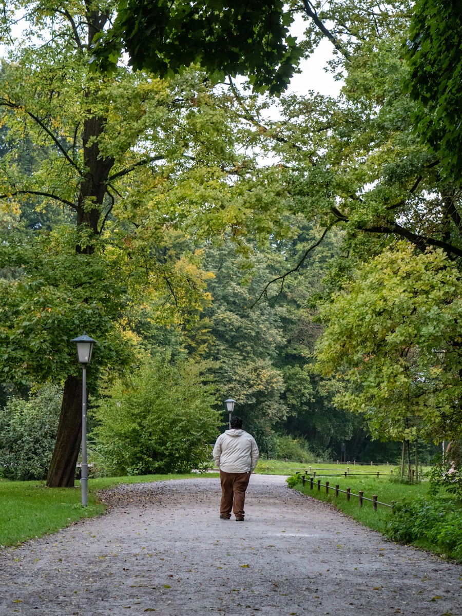 Person walking on a gravel path in a park during an outdoor break